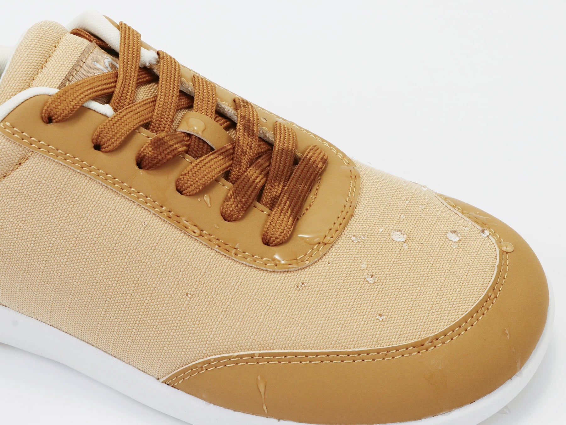 Footle Water-Resistant in Camel · Water beads on the upper